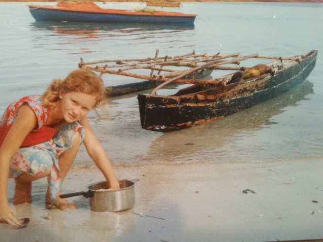 Me washing a pot on the beach.